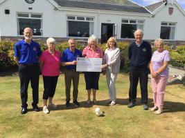 President, Stewart McNeish, hands over a cheque for over £1,500 to the Grantown Highland Hospice Fundraisers which was their share of the monies raised on the day. 
